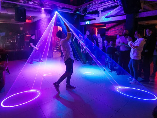 KeoBin L2600 laser party light energizing a club dance floor